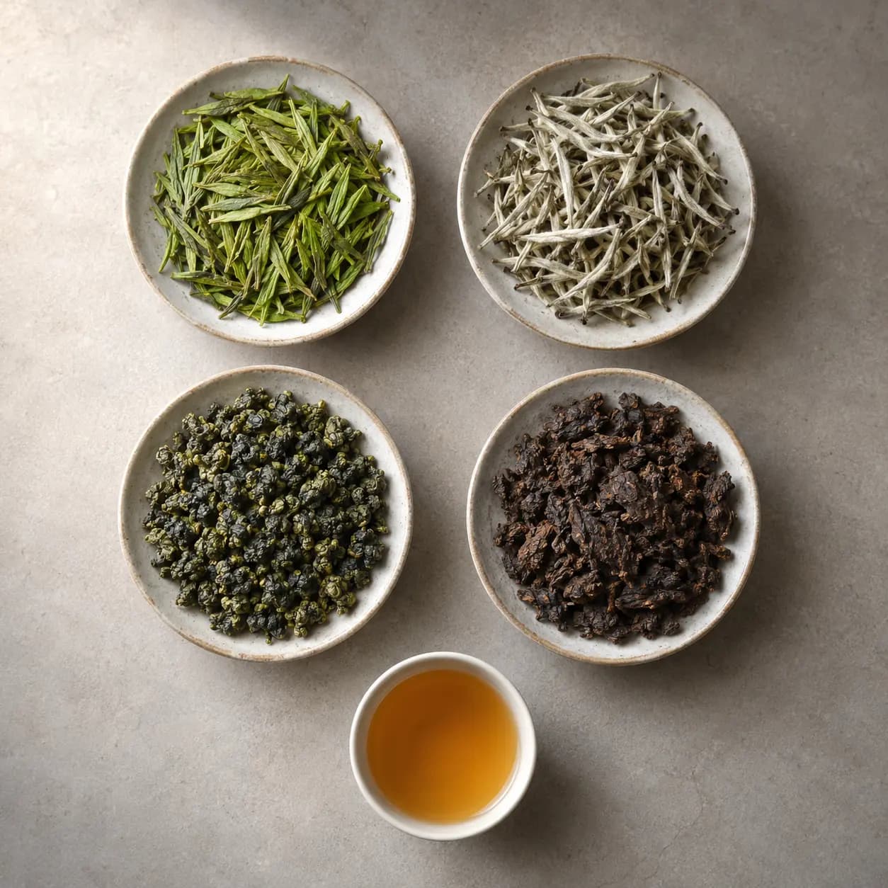 Several Chinese tea types arranged to compare their leaves and colors